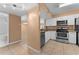 Modern kitchen with stainless steel appliances and granite countertops at 533 Villa Del Sol Cir # 103, Orlando, FL 32824