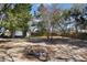 Large backyard with fire pit and detached garage at 540 Fern Ave, Tavares, FL 32778