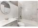 Bathroom with marble tile, bathtub, and vanity with sink at 540 Fern Ave, Tavares, FL 32778