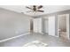 Bedroom with tile floors, ceiling fan, and access to bathroom at 540 Fern Ave, Tavares, FL 32778