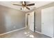 Well-lit bedroom with tile floors and ample closet space at 540 Fern Ave, Tavares, FL 32778
