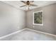 Small bedroom with tile floors and ceiling fan at 540 Fern Ave, Tavares, FL 32778