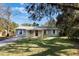 Charming one-story home with a well-maintained lawn and covered porch at 540 Fern Ave, Tavares, FL 32778
