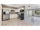 Modern kitchen with stainless steel appliances and white cabinets at 540 Fern Ave, Tavares, FL 32778