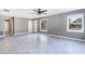 Bright and airy living room with tile flooring and neutral decor at 540 Fern Ave, Tavares, FL 32778
