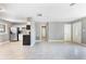 Open concept living area with kitchen views and tile floors at 540 Fern Ave, Tavares, FL 32778