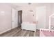 bedroom with white furniture and pink walls at 5539 Bowman Dr, Winter Garden, FL 34787