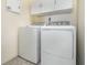 Laundry room with washer and dryer, and cabinets at 5539 Bowman Dr, Winter Garden, FL 34787