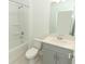 Clean bathroom with gray vanity, tub, and shower at 5701 Le Marin Way, Kissimmee, FL 34758
