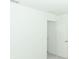 Well-lit bedroom with neutral walls and carpet, offering access to hallway at 5701 Le Marin Way, Kissimmee, FL 34758