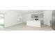 Kitchen features gray cabinets, island, and sliding door to backyard at 5701 Le Marin Way, Kissimmee, FL 34758