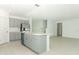 Modern kitchen with gray cabinets, island, and stainless steel appliances at 5701 Le Marin Way, Kissimmee, FL 34758