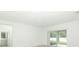 Spacious living room with sliding glass doors leading to backyard at 5701 Le Marin Way, Kissimmee, FL 34758