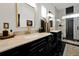 Elegant bathroom with marble countertops, double sinks, and a walk-in shower at 606 E Amelia St, Orlando, FL 32803