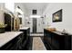 Spa-like bathroom with double sinks, marble countertops, and a large shower at 606 E Amelia St, Orlando, FL 32803