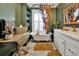 Charming bathroom with clawfoot tub, white vanity, and green walls at 606 E Amelia St, Orlando, FL 32803