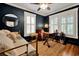 Cozy bedroom with daybed, window shutters and wood floors at 606 E Amelia St, Orlando, FL 32803