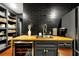 Modern butler's pantry with wood countertops, wine cooler, and ample shelving at 606 E Amelia St, Orlando, FL 32803