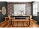 Charming dining room features a dark wood table, patterned wallpaper, and stylish seating at 606 E Amelia St, Orlando, FL 32803