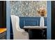 Elegant dining room with dark blue walls and tropical wallpaper at 606 E Amelia St, Orlando, FL 32803