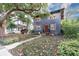 Charming two-story home with a red door and landscaping at 606 E Amelia St, Orlando, FL 32803
