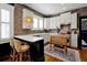 Modern kitchen with white cabinets, brick backsplash, and an island at 606 E Amelia St, Orlando, FL 32803