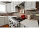 Stainless steel appliances and white cabinetry in this kitchen at 606 E Amelia St, Orlando, FL 32803