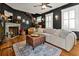 Living room with a fireplace, hardwood floors, and ample seating at 606 E Amelia St, Orlando, FL 32803