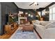 Spacious living room featuring a fireplace, hardwood floors, and a comfy sofa at 606 E Amelia St, Orlando, FL 32803