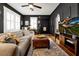 Living area showcasing a stylish sofa, hardwood floors, and a fireplace at 606 E Amelia St, Orlando, FL 32803