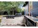 Brick outdoor kitchen with Blackstone griddle and sink at 606 E Amelia St, Orlando, FL 32803