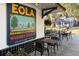 Charming outdoor seating area with a vintage sign, perfect for enjoying a meal in a relaxed atmosphere at 606 E Amelia St, Orlando, FL 32803