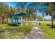 Beautiful park featuring a blue gazebo, lush greenery, and a walking path, offering a serene escape at 606 E Amelia St, Orlando, FL 32803