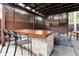Outdoor kitchen and bar area with brick and wood finishes at 606 E Amelia St, Orlando, FL 32803