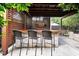 Outdoor kitchen and bar area with brick and wood finishes at 606 E Amelia St, Orlando, FL 32803