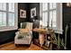 Sitting area with a comfortable chair and a stylish side table at 606 E Amelia St, Orlando, FL 32803