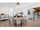 Elegant dining area with a round table and chairs near the kitchen and sunroom at 610 Parkwood Ave, Altamonte Springs, FL 32714