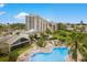 Aerial view showing resort amenities including pool and building at 6165 Carrier Dr # 3707, Orlando, FL 32819