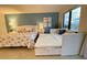 Bedroom with queen bed and trundle, offering ample sleeping space for guests at 6165 Carrier Dr # 3707, Orlando, FL 32819