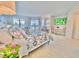 Main bedroom with a king-size bed and city views at 6165 Carrier Dr # 3707, Orlando, FL 32819
