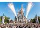 Crowd watches fireworks over Cinderella Castle at 6165 Carrier Dr # 3707, Orlando, FL 32819