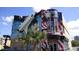 Gift shop with patriotic mural and space shuttle at 6165 Carrier Dr # 3707, Orlando, FL 32819