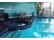 Indoor heated pool and spa with a whimsical ocean theme at 6165 Carrier Dr # 3707, Orlando, FL 32819