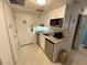 Small kitchen with microwave, stovetop, and refrigerator at 6165 Carrier Dr # 3707, Orlando, FL 32819