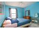 Bedroom with a double bed and light blue walls at 741 Caribou Dr, Kissimmee, FL 34759
