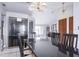 Dining room with black table, chairs, and view into living room at 741 Caribou Dr, Kissimmee, FL 34759