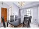 Dining room with a black table and chairs near the entrance at 741 Caribou Dr, Kissimmee, FL 34759