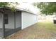 Rear exterior view of house and screened porch at 741 Caribou Dr, Kissimmee, FL 34759