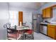 Cozy kitchen nook with table and chairs, adjacent to kitchen at 741 Caribou Dr, Kissimmee, FL 34759