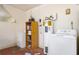 Laundry room with washer, dryer, and shelving at 741 Caribou Dr, Kissimmee, FL 34759